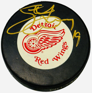 Steve Yzerman Autographed Vintage Detroit Red Wings Puck (JSA)