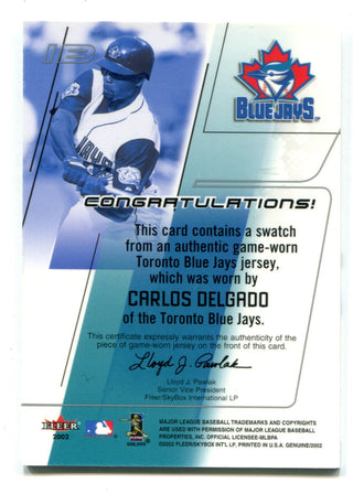 Carlos Delgado 2002 Fleer Genuine Names of The Game Jersey Card